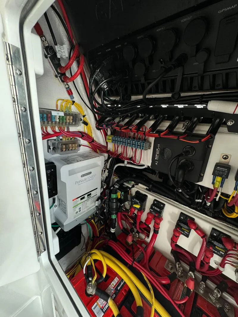 Slide: The Image of Electrical system compartment of 2024 Valhalla Boatworks V-28, showcasing wiring and components. - 41