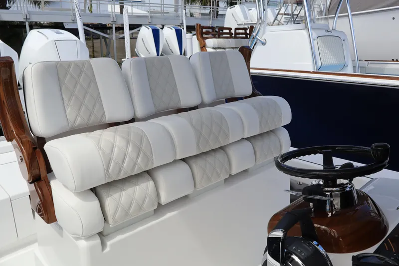 Slide: The Image of 2024 Valhalla Boatworks V-28 helm seating with diamond-stitched upholstery. - 5