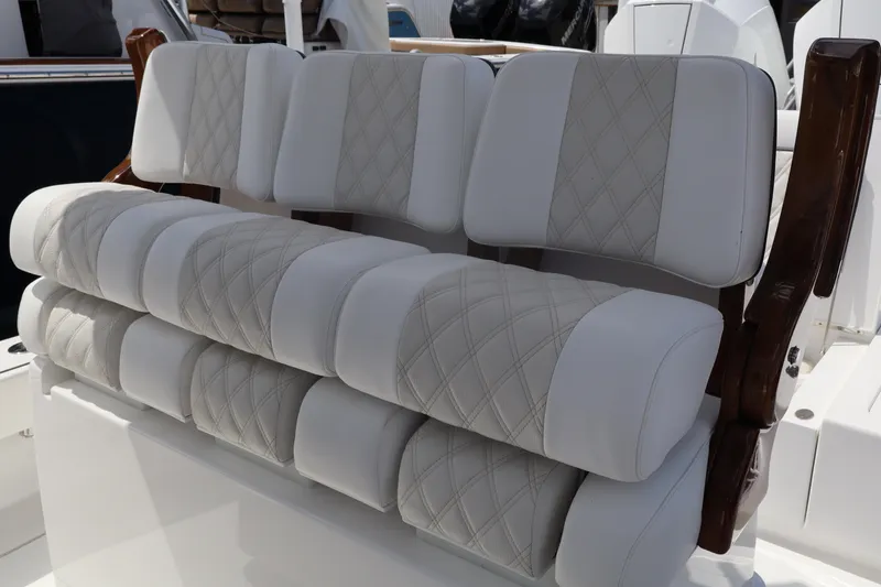 Slide: The Image of 2024 Valhalla Boatworks V-28 cushioned seating with diamond-stitched upholstery. - 6