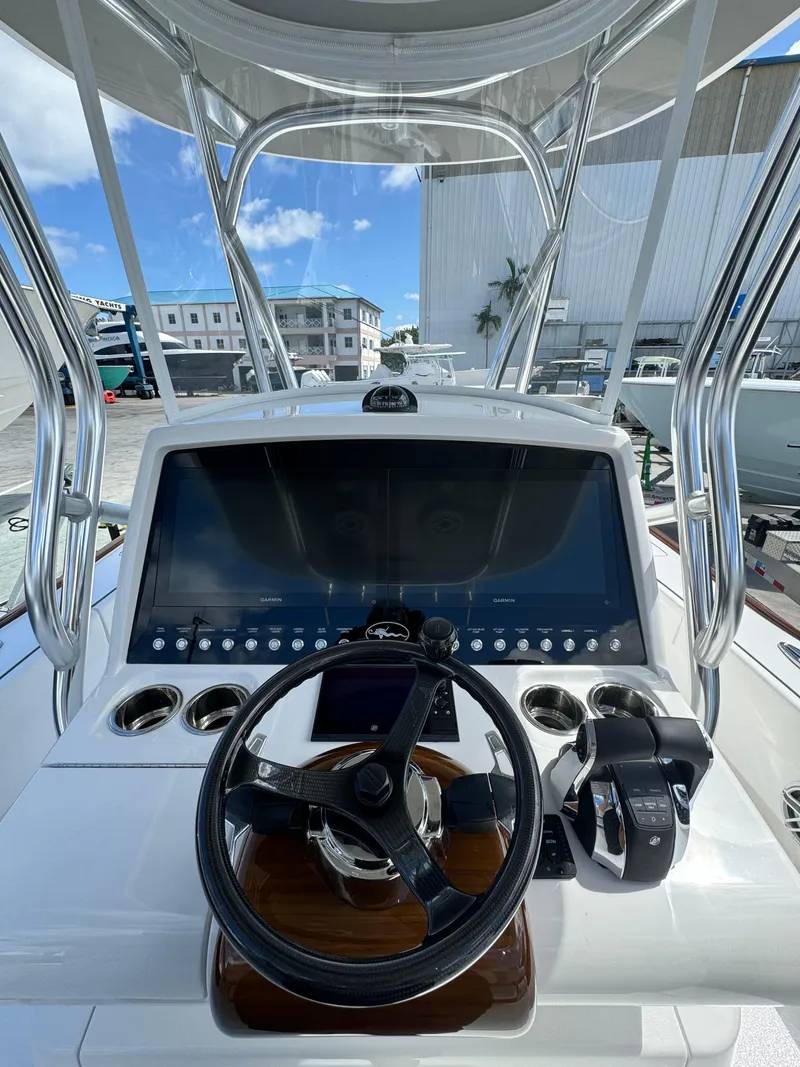 Slide: The Image of 2024 Valhalla Boatworks V-28 helm station with modern controls and navigation display. - 8