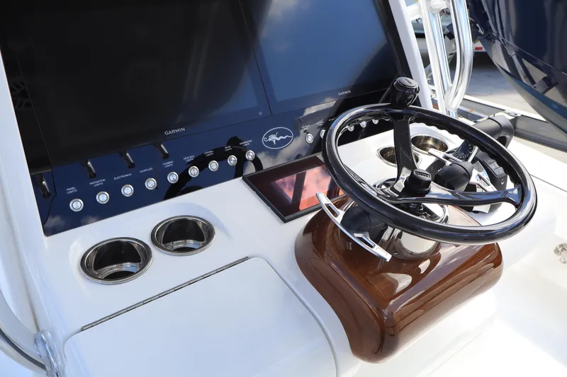 Slide: The Image of 2024 Valhalla Boatworks V-28 helm with steering wheel and control panel. - 9