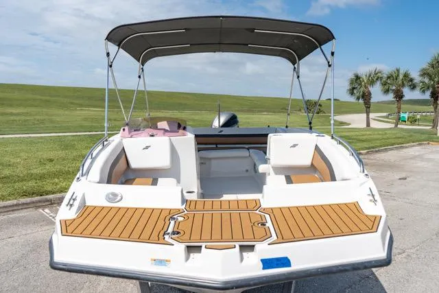 Slide: The Image of 2022 Starcraft SVX 171 OB boat with bimini top and spacious deck. - 12