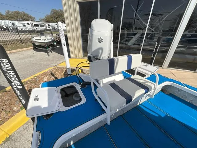 Slide: The Image of 2024 Majek 25 ILLUSION boat with Suzuki outboard motor and blue deck. - 12