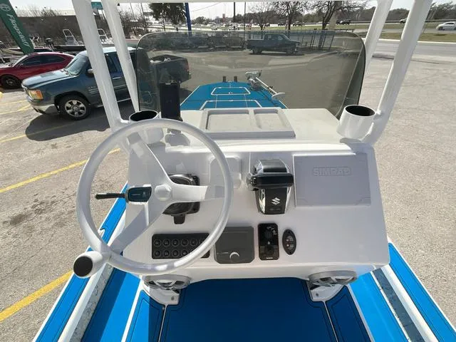 Slide: The Image of 2024 Majek 25 ILLUSION boat dashboard with steering wheel and controls. - 7