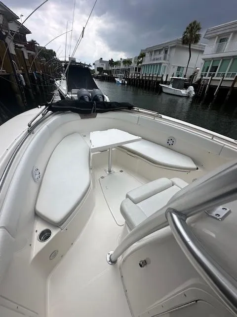 Slide: The Image of 2015 Robalo R300 Center Console boat docked in a marina. - 4