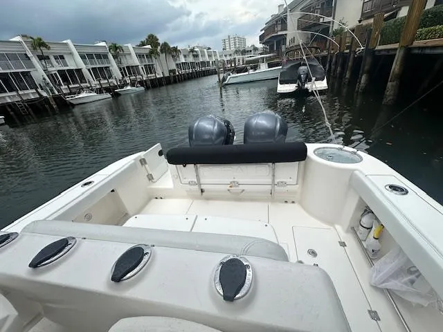 Slide: The Image of 2015 Robalo R300 Center Console boat docked in a marina. - 7