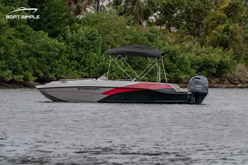 Slide: The Image of 2022 Starcraft SVX 211 OB boat on water with Yamaha outboard motor. - 3