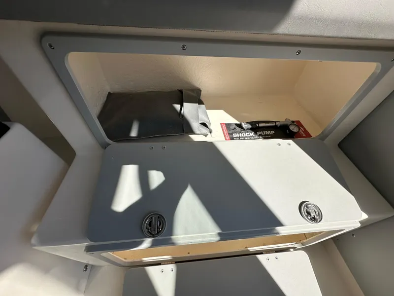 Slide: The Image of Storage compartment in 2024 Defiance Admiral 270 EX boat. - 14