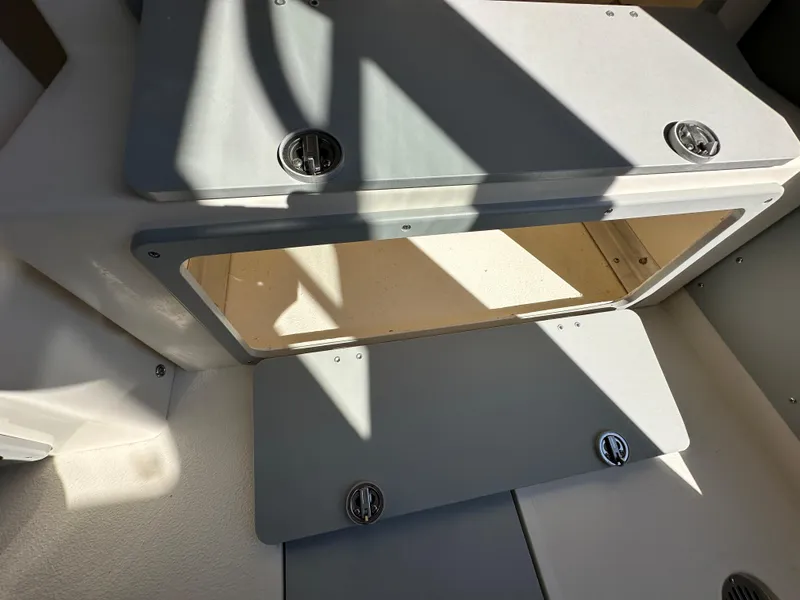 Slide: The Image of 2024 Defiance Admiral 270 EX boat storage compartment with open hatch. - 15