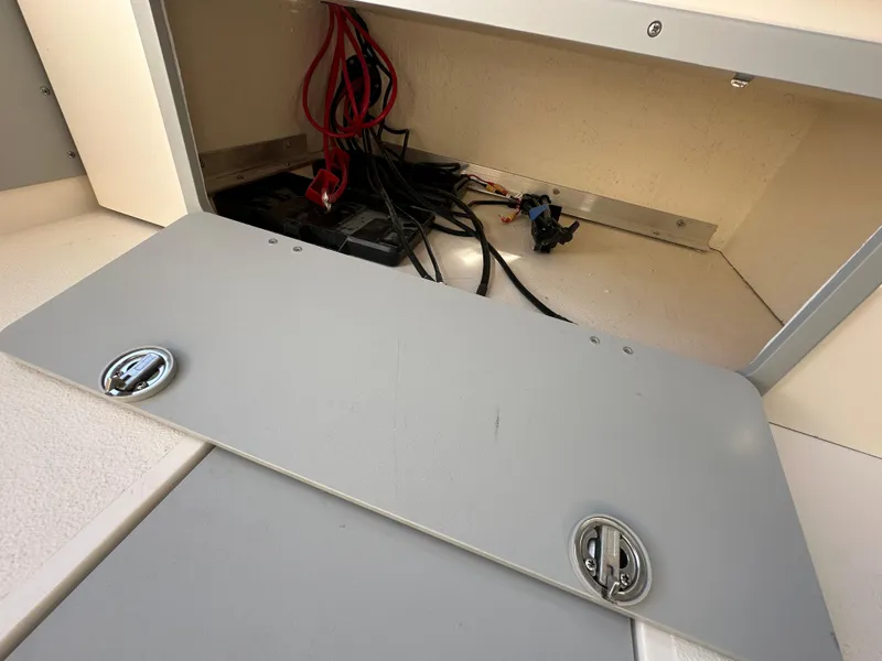 Slide: The Image of Battery compartment of 2024 Defiance Admiral 270 EX boat with wiring. - 17
