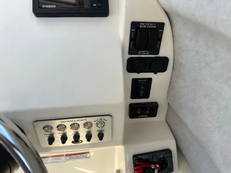 Slide: The Image of Control panel of the 2024 Defiance Admiral 270 EX boat. - 20