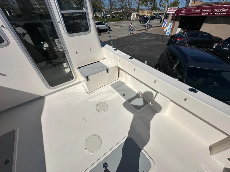 Slide: The Image of 2024 Defiance Admiral 270 EX boat deck at South Shore Marine dealership. - 5