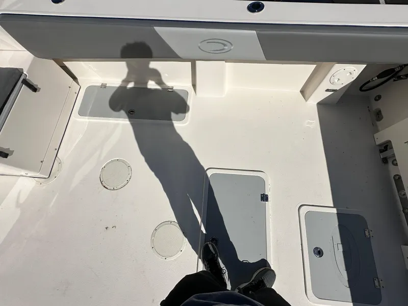 Slide: The Image of 2024 Defiance Admiral 270 EX boat deck with storage compartments. - 7