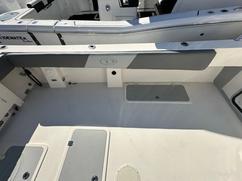 Slide: The Image of 2024 Defiance Admiral 270 EX boat deck with storage compartments. - 9