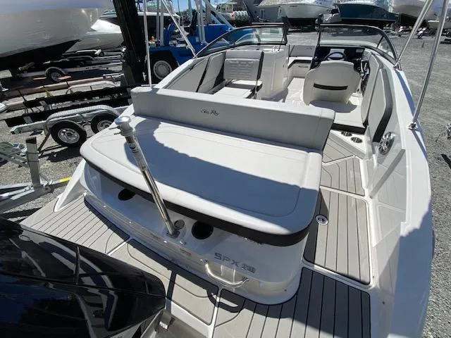 Slide: The Image of 2024 Sea Ray SPX 210 OB boat, rear seating and deck view. - 10