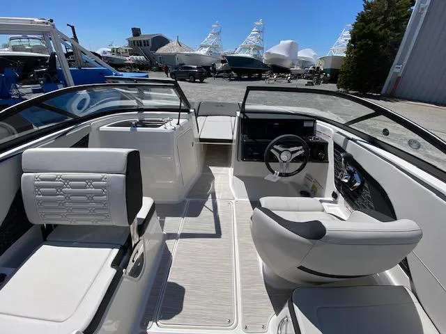 Slide: The Image of Interior of 2024 Sea Ray SPX 210 OB boat with modern seating and steering console. - 5