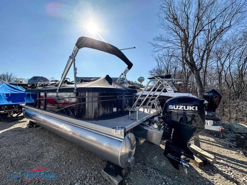 Slide: The Image of 2023 Crest CLASSIC LX 240 SLC pontoon boat with Suzuki outboard motor in sunlight. - 2