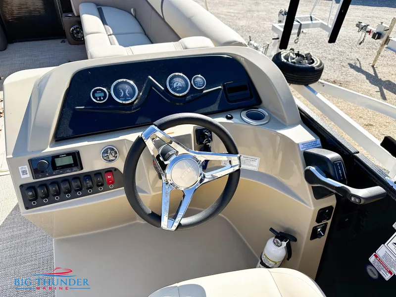 Slide: The Image of 2023 Crest CLASSIC LX 240 SLC boat dashboard with steering wheel and control panel. - 4