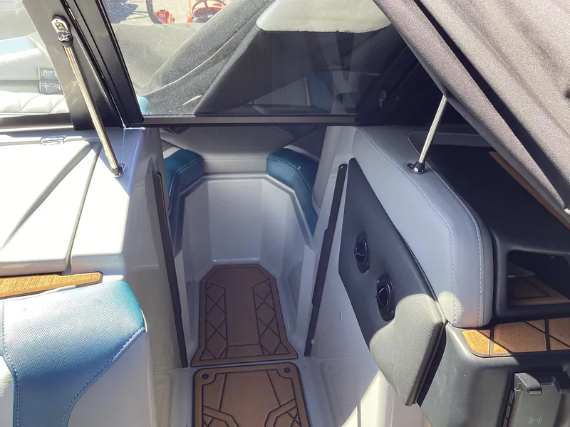 Slide: The Image of Interior of a 2020 Tigé 21ZX boat with seating and storage compartments. - 14