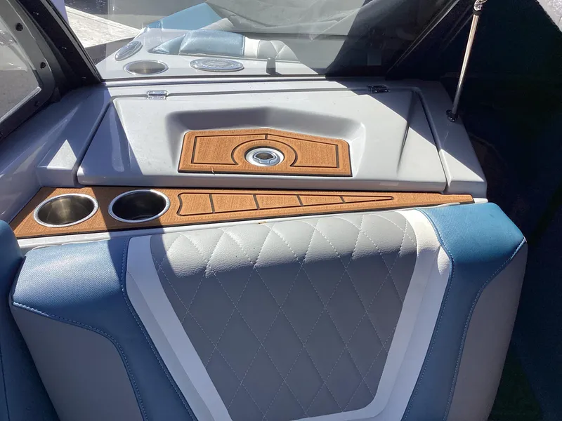 Slide: The Image of 2020 Tigé 21ZX boat interior with cup holders and diamond-stitched upholstery. - 15
