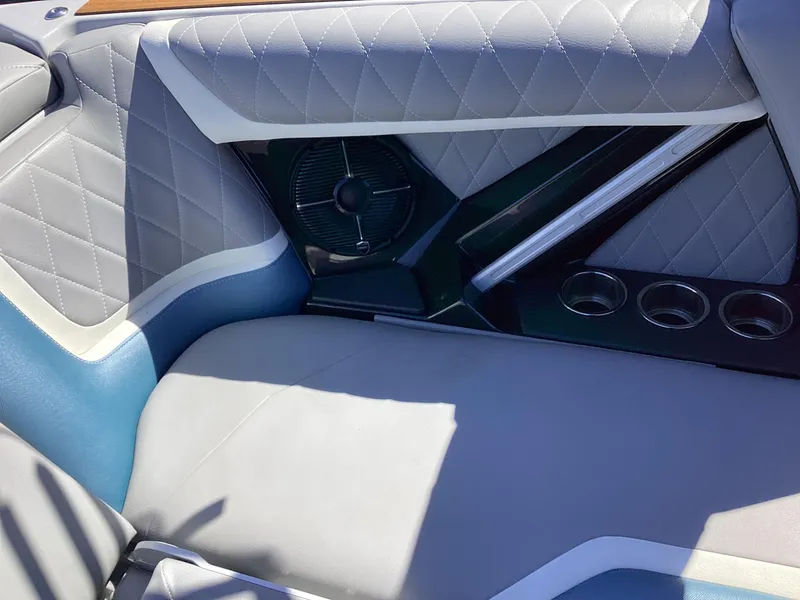 Slide: The Image of Interior seating of a 2020 Tigé 21ZX boat with quilted upholstery. - 17