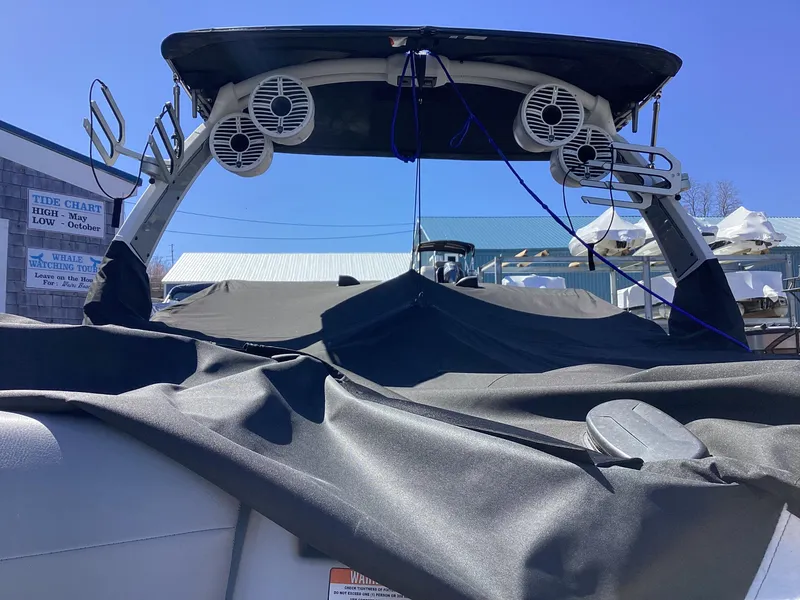 Slide: The Image of 2020 Tigé 21ZX boat with covered seating and tower speakers. - 19