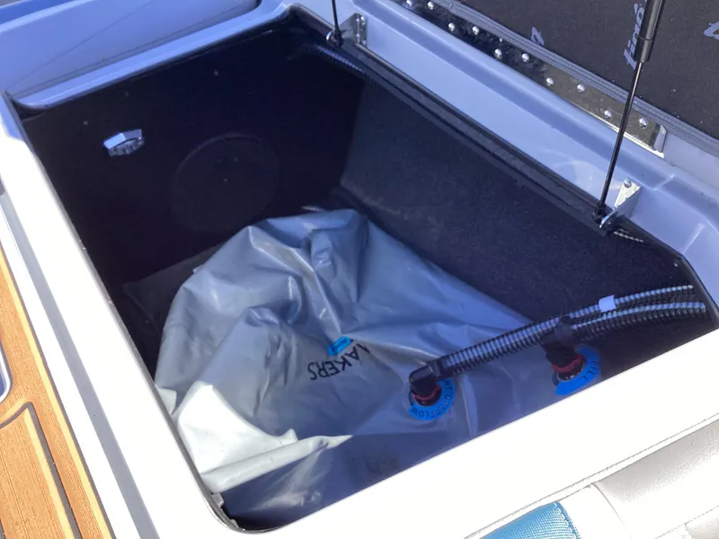 Slide: The Image of 2020 Tigé 21ZX boat storage compartment with ballast bag. - 7