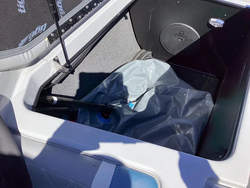 Slide: The Image of 2020 Tigé 21ZX boat storage compartment with ballast bag. - 8