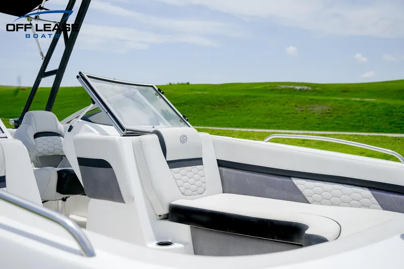 Slide: The Image of 2020 Hurricane 217 SD boat interior with white and gray seating. - 6