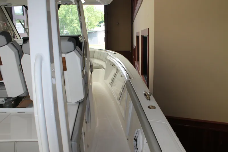 Slide: The Image of 2025 Pursuit S 358 Sport boat interior, side view of deck and seating. - 12