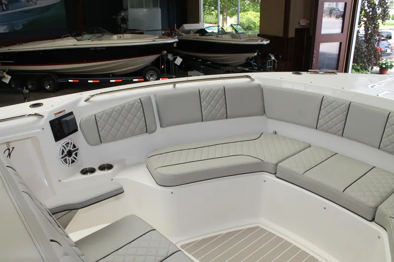 Slide: The Image of 2025 Pursuit S 358 Sport boat interior with cushioned seating and modern design. - 21