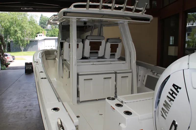 Slide: The Image of 2025 Pursuit S 358 Sport boat with Yamaha engine in a garage. - 4