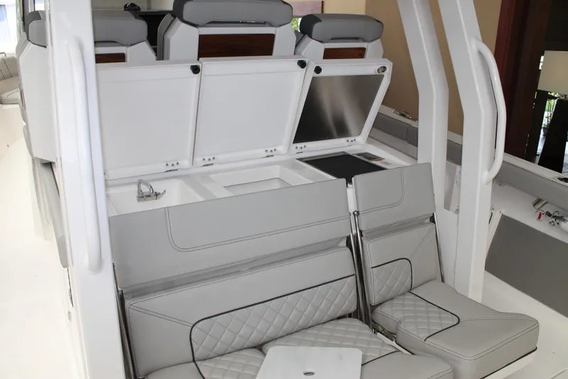Slide: The Image of 2025 Pursuit S 358 Sport boat interior with luxurious seating and modern design. - 9