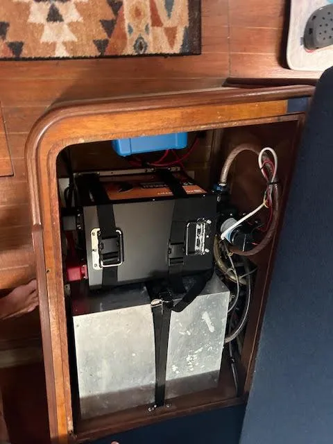 Slide: The Image of Battery compartment of a 1988 Sabre 38 sailboat with wiring and components. - 11
