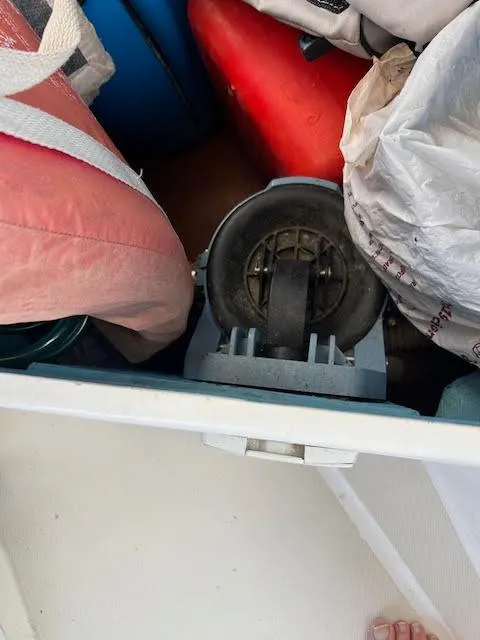 Slide: The Image of Storage compartment on a 1988 Sabre 38 sailboat with various boating equipment. - 17