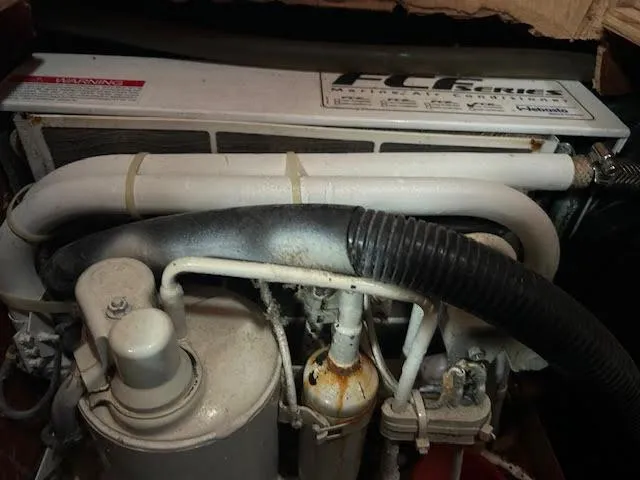 Slide: The Image of 1988 Sabre 38 engine compartment with FCF unit and hoses - 23