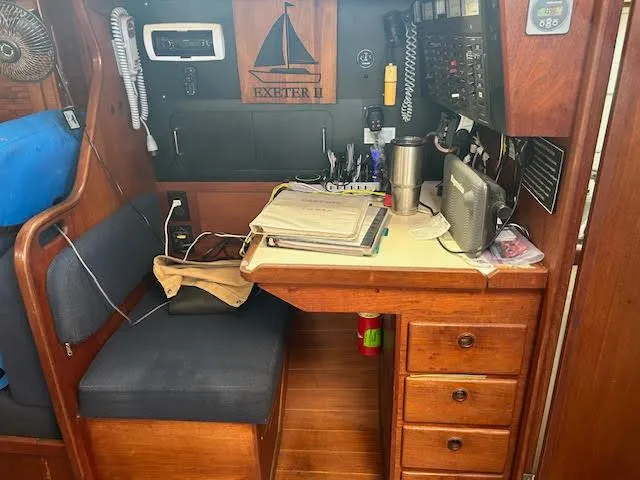 Slide: The Image of Navigation station on a 1988 Sabre 38 sailboat with desk, electronics, and storage drawers. - 27