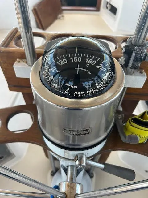 Slide: The Image of Compass on the helm of a 1988 Sabre 38 sailboat. - 36