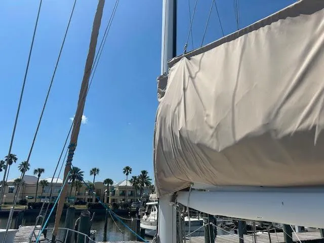 Slide: The Image of Sabre 38 sailboat from 1988 docked at a marina on a sunny day. - 5