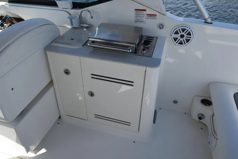 Slide: The Image of 2009 Sea Ray 300 SLX boat interior with sink and grill station. - 17