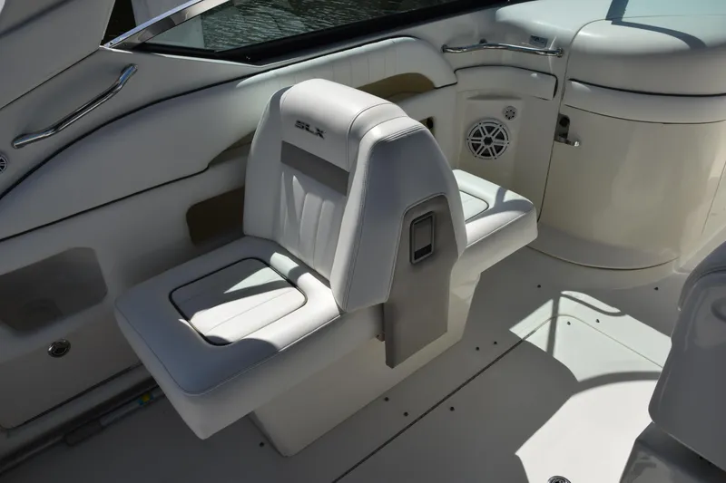 Slide: The Image of 2009 Sea Ray 300 SLX boat interior with white leather seating and modern design. - 18