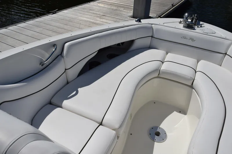 Slide: The Image of Luxurious seating on a 2009 Sea Ray 300 SLX boat, docked by the water. - 22