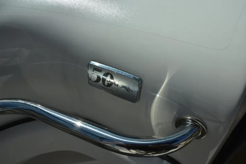 Slide: The Image of Chrome detail on 2009 Sea Ray 300 SLX boat with "50" emblem. - 29