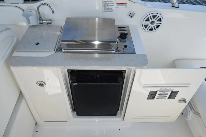 Slide: The Image of 2009 Sea Ray 300 SLX boat kitchenette with sink, grill, and storage. - 30