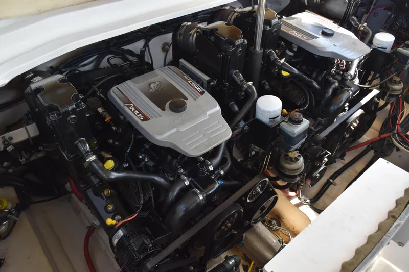 Slide: The Image of Engine compartment of a 2009 Sea Ray 300 SLX boat, featuring dual inboard motors. - 33