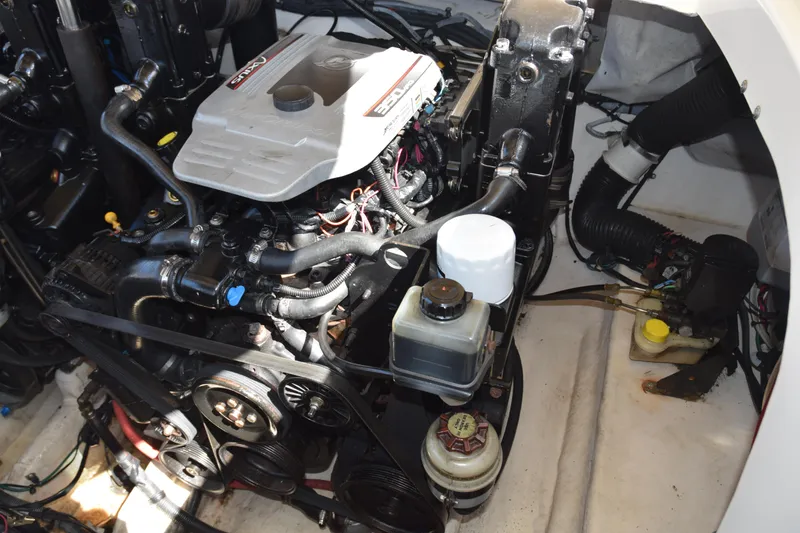Slide: The Image of Engine compartment of a 2009 Sea Ray 300 SLX boat, showcasing mechanical components. - 34