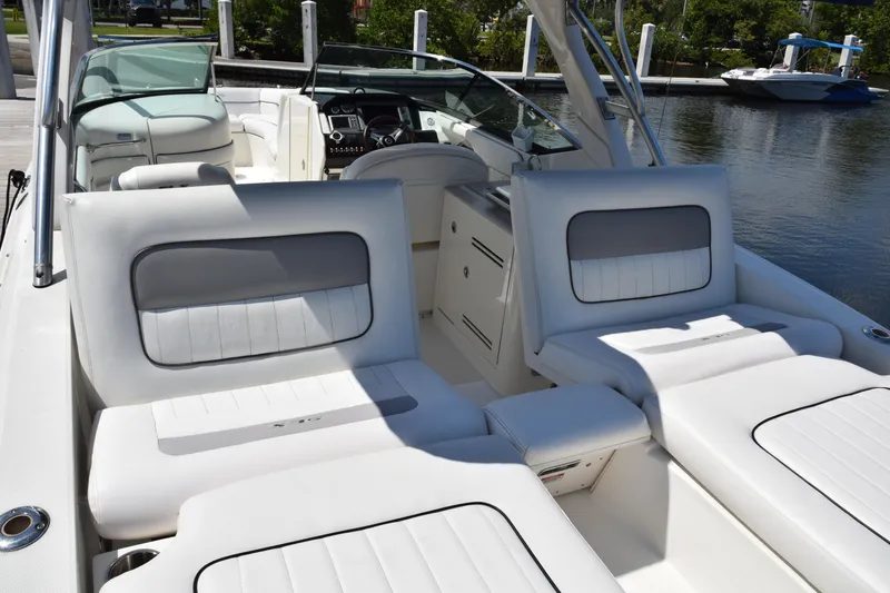 Slide: The Image of 2009 Sea Ray 300 SLX boat interior with white seating and dashboard view. - 40