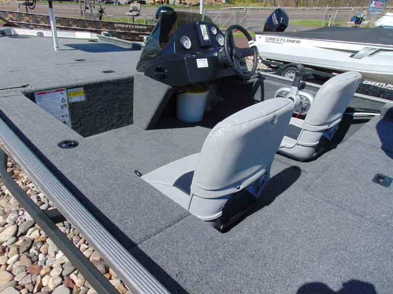 Slide: The Image of 2024 Crestliner 1600 Storm boat interior with dual seats and steering console. - 3