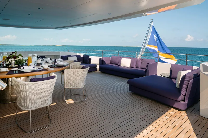 Slide: The Image of Luxurious Heesen 50m Aluminum yacht interior, 2021 model, featuring elegant seating and a sleek bar area. - 23