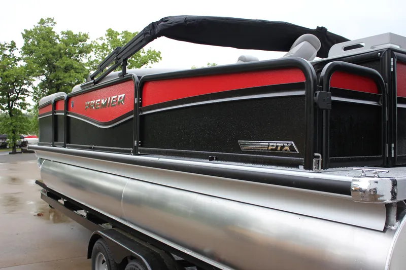 Slide: The Image of 2024 Premier 230 SunSation Angler pontoon boat with black and red exterior. - 15
